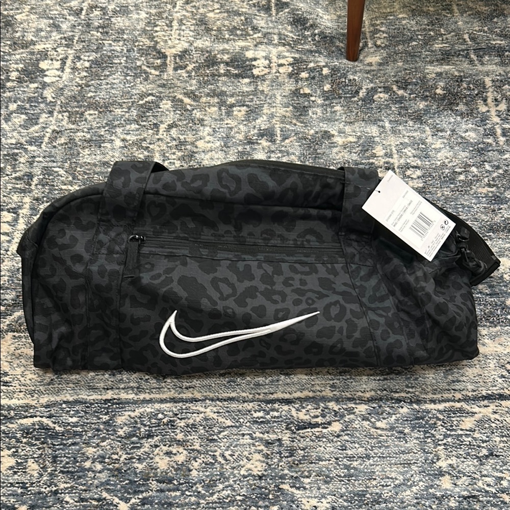 Nike Black Duffel Bag with Iconic Swoosh and Durable Design